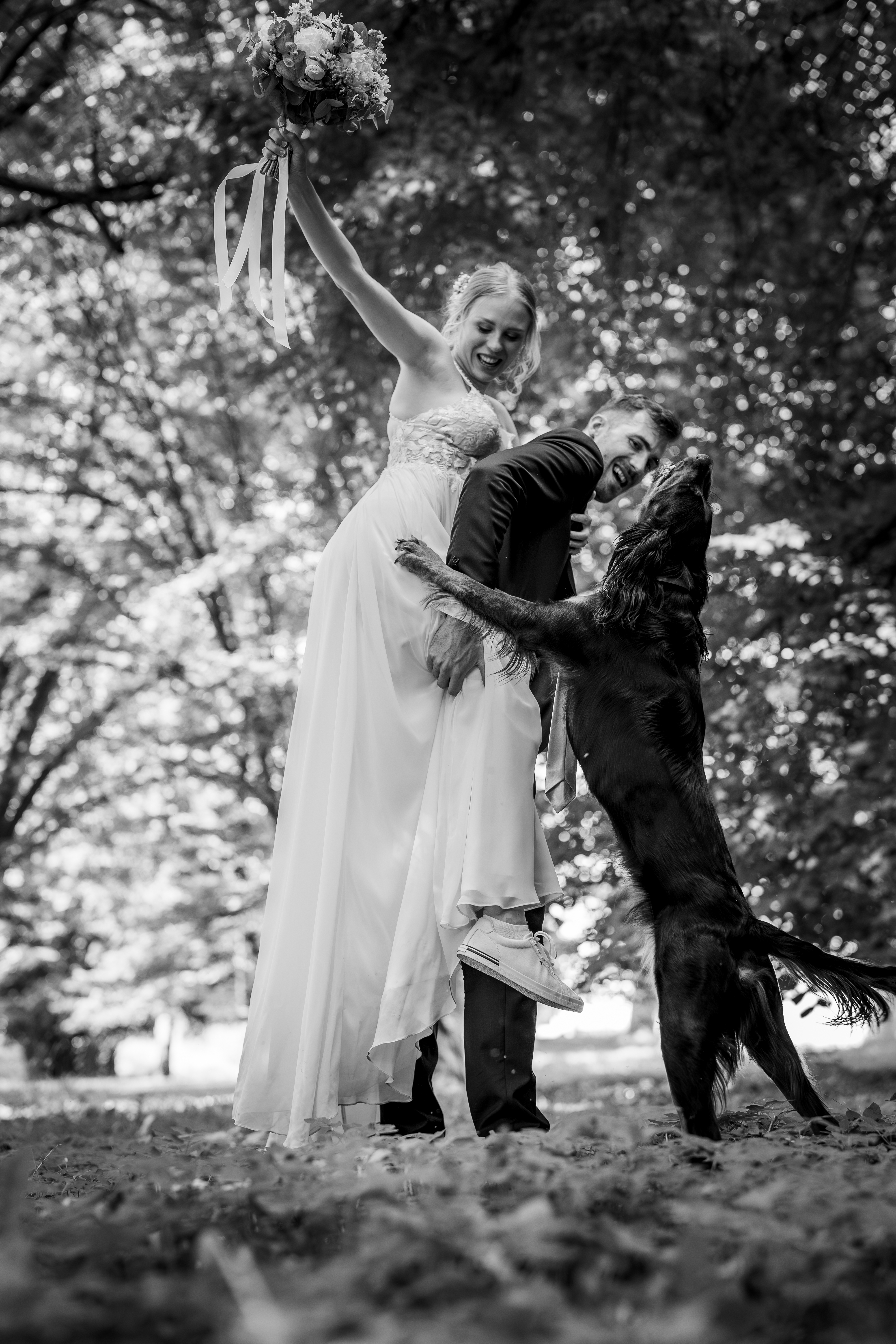 Black and white wedding photo dog photobombing couple Czech Republic