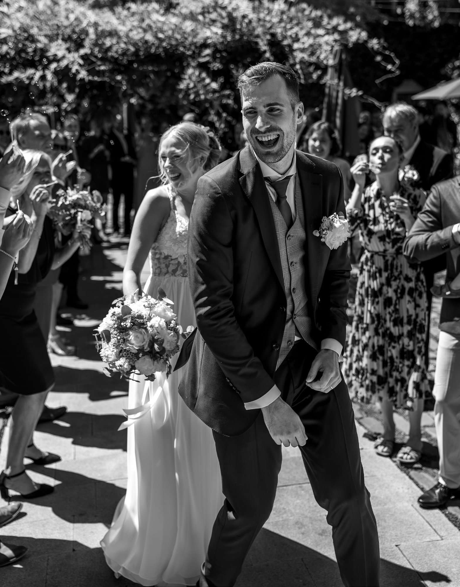 Groom laughing genuine emotion black and white wedding photo