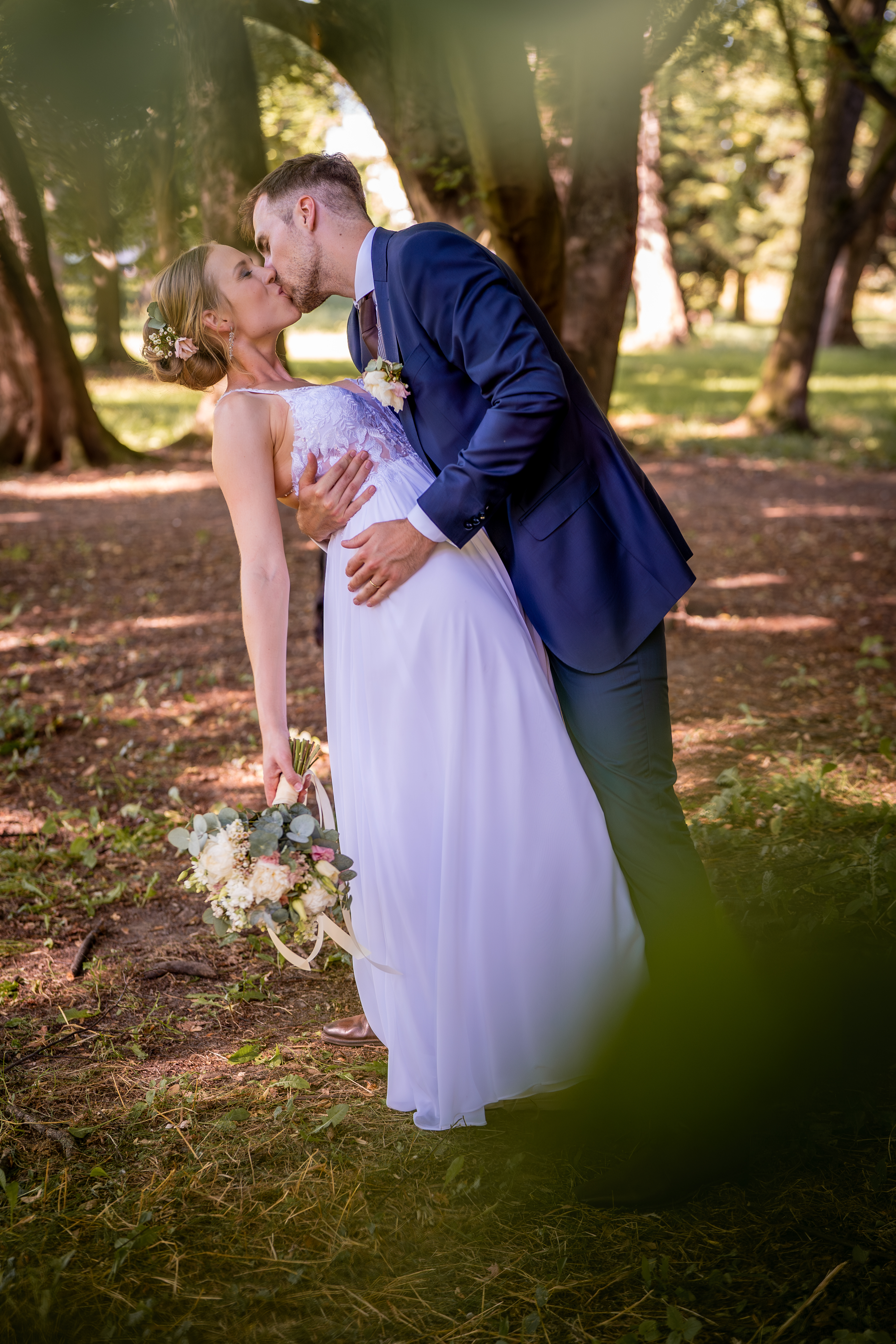 Intimate forest kiss destination wedding photographer Central Europe