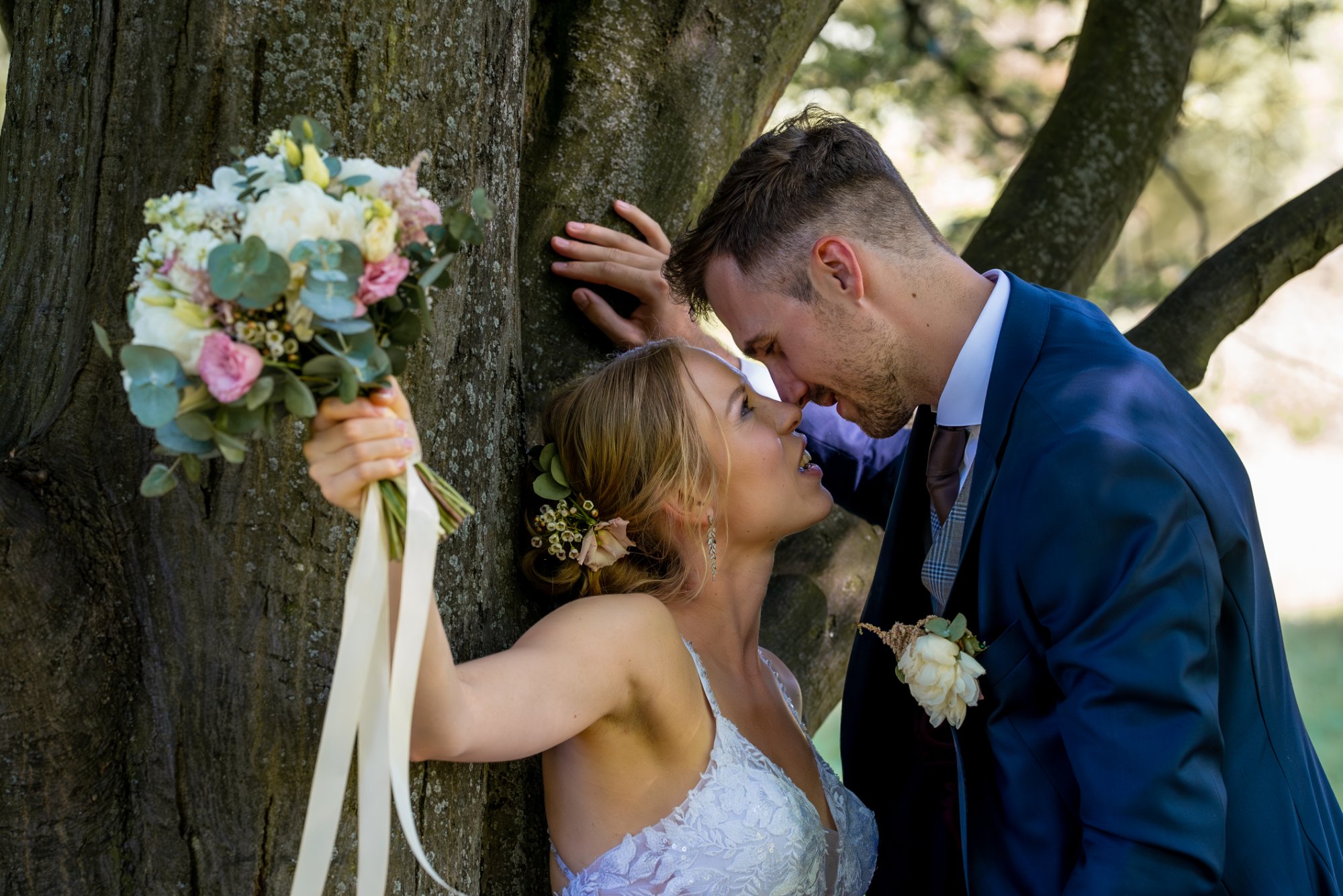 Wedding couple portrait by tree Czech countryside destination wedding